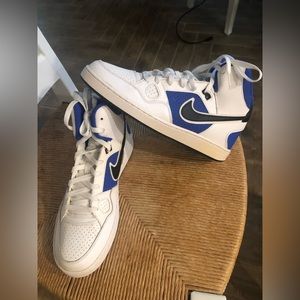 Men size 10.5 white and blue Nike Air forces.